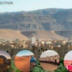 alt="Camel caravan crossing Sahara dunes at sunset