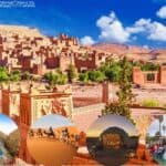 Ancient mudbrick village of Aรฏt Benhaddou surrounded by desert hills.