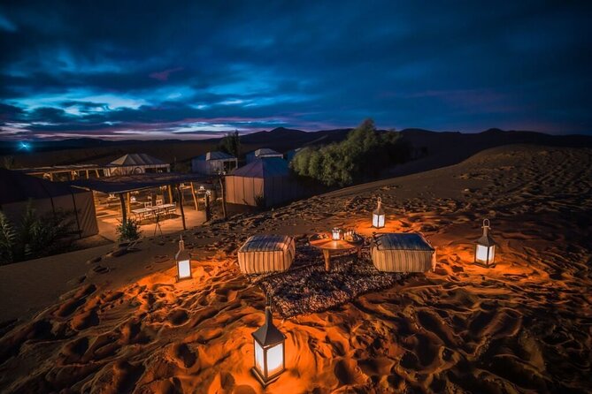 Sahara Desert Camp Morocco – Overnight Experience on Marrakech to Fes Tour Traditional Sahara desert camp in Merzouga with tents, Berber music, and starry night sky during a 4-day Marrakech to Fes desert tour