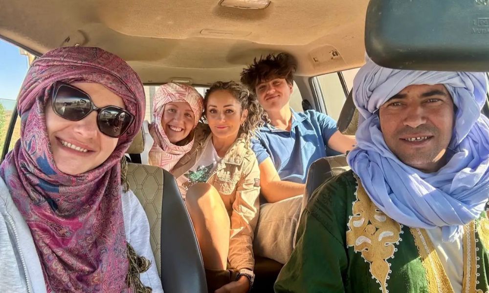 Fes to Marrakech Desert Tour – Camel Trek in Erg Chebbi Camel trek at sunset during Fes to Marrakech Desert Tour in the Erg Chebbi dunes of Merzouga.